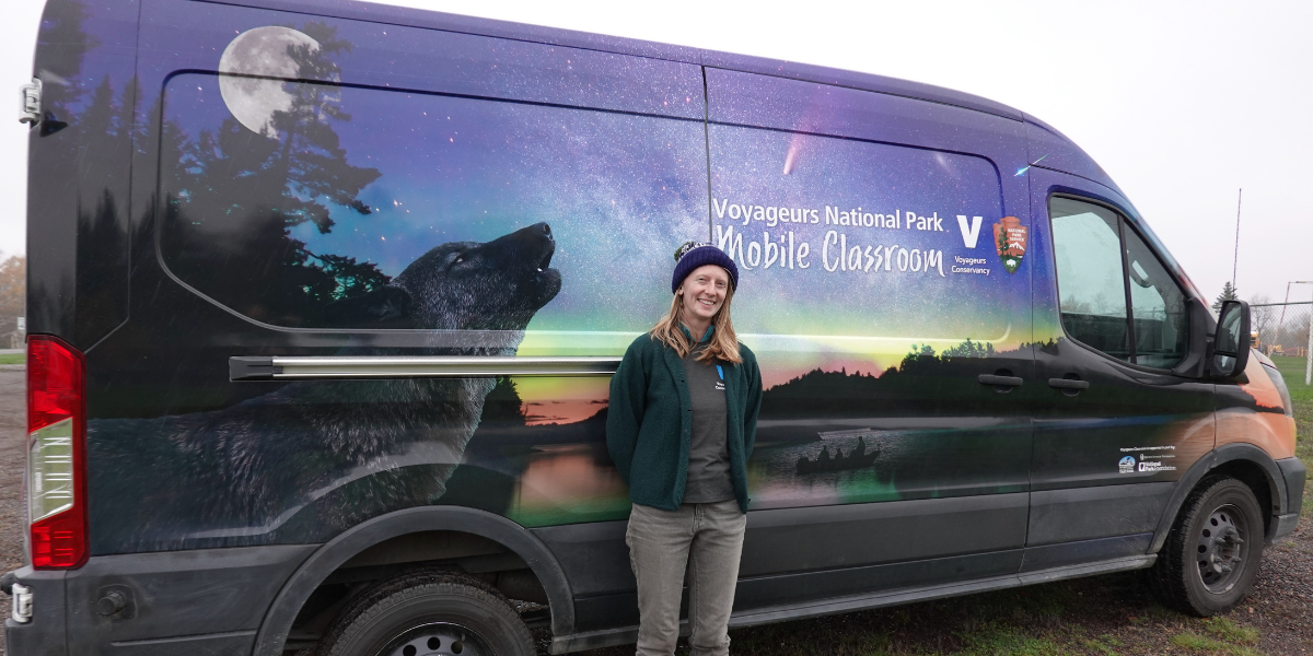 Moss Schumacher in front the of the Voyageurs Mobile Classroom