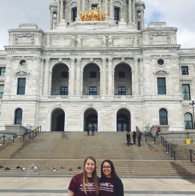 2 Social Work students standing in front of the St. Paul Minnesota capitol building