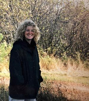 Debbie Petersen with a fall background