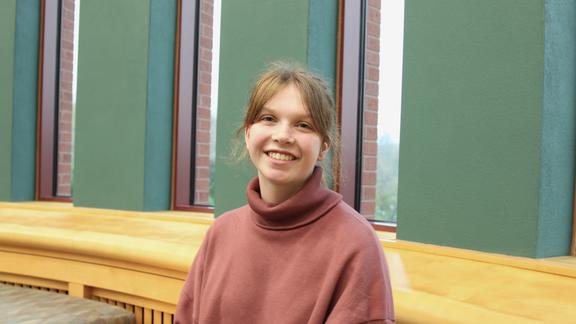 Erika, a UMD student posing for a photograph in UMD's library