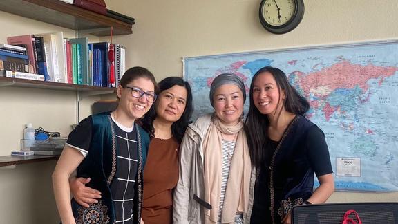 Two Kazahk scholars with Viann and a graduate student
