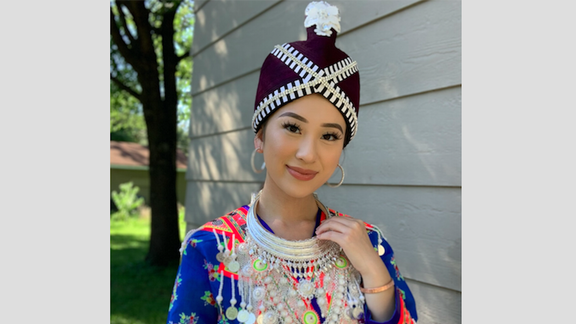 Christina Yang dressed in colorful Hmong clothing