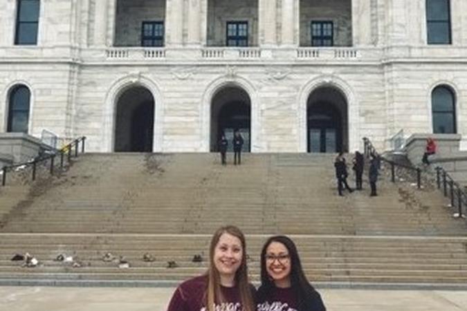 2 Social Work students standing in front of the St. Paul Minnesota capitol building