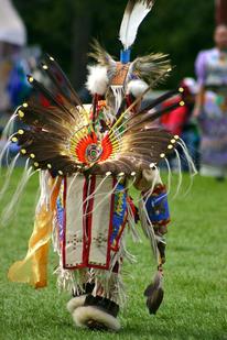 American Indian person dancing at a pow wow