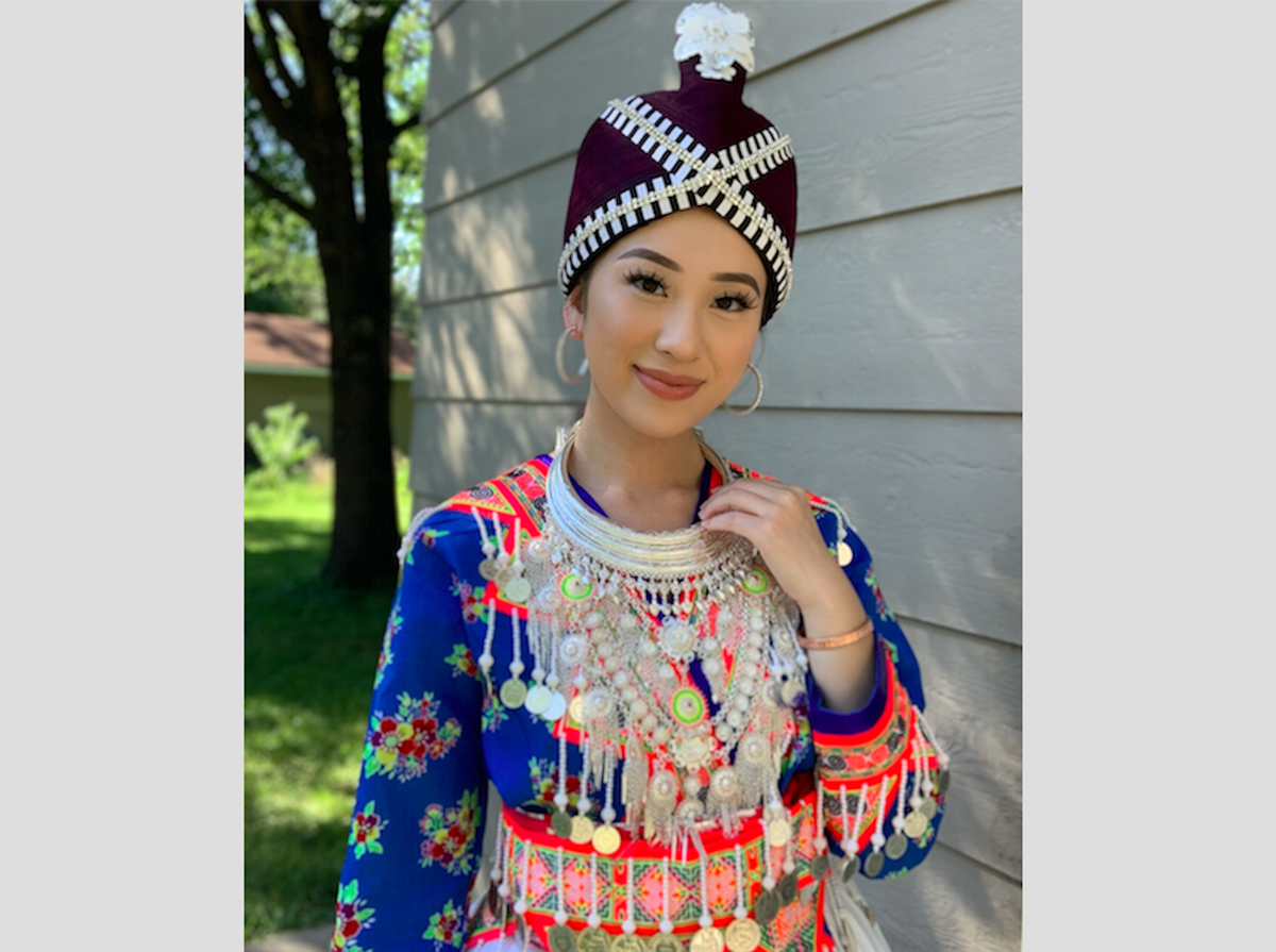 Christina Yang dressed in colorful Hmong clothing