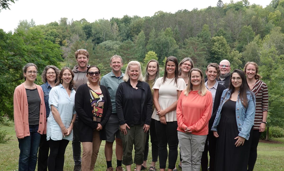 Social work faculty and staff together in Bagley nature area