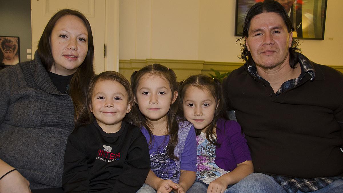 An American Indian family, smiling