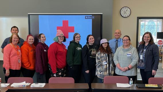Image: The first cohort of JICC with the training team and the Denfeld High School Principal. From L to R: Ben Johnson (Arrowhead Safety Solutions - First Aid/CPR), Peg Johnson (JICC), Tom Tusken (Denfeld Principal), Jodie Riek (UMD Early Childhood Education Program Coordinator) and Kristi Wickstrom (Child Care Aware MN). 