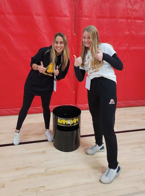 Two students at MNShape event giving the thumbs up