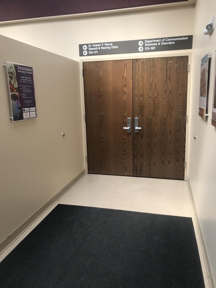 Double wood doors which lead into speech language hearing clinic