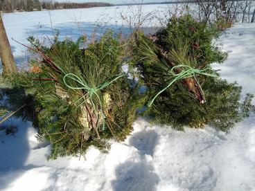 Two wreath kits against the snow