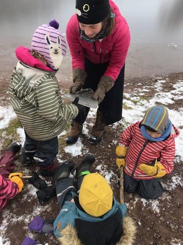 Lexi Bruno outside with a group of children in the winter