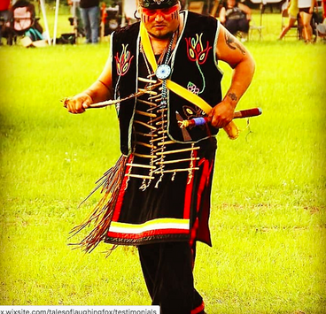 person in Native dress, dancing