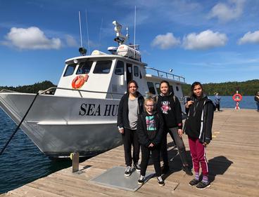Four participants in the Voyage of Discovery Program: Nedda Ramona Raine, Amelie Raine, Annelise Hecker and (front) Madison Sundvick