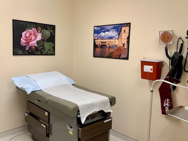Two photos are displayed in a health services exam room